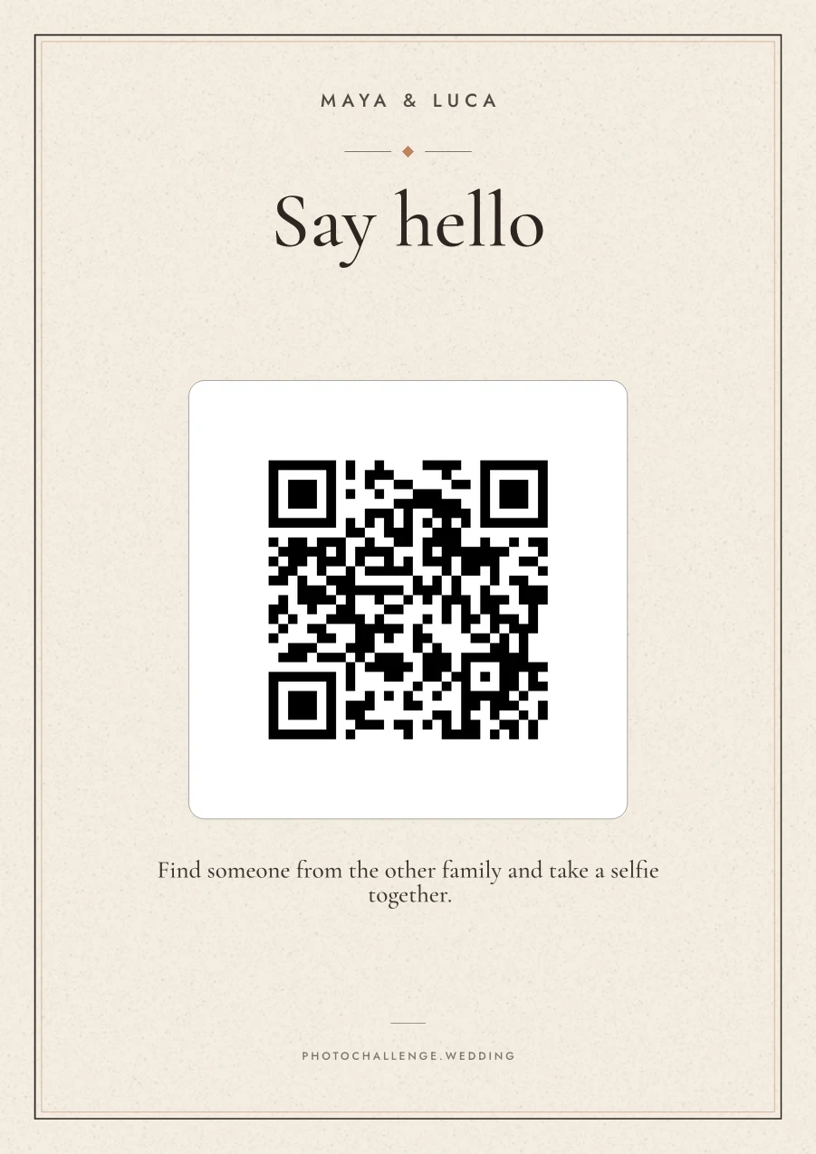 A wedding sign in warm sand titled Say hello, asking guests to find someone from the other family and take a selfie together